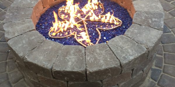 Striking paver firepit by The Legacy Paver Group