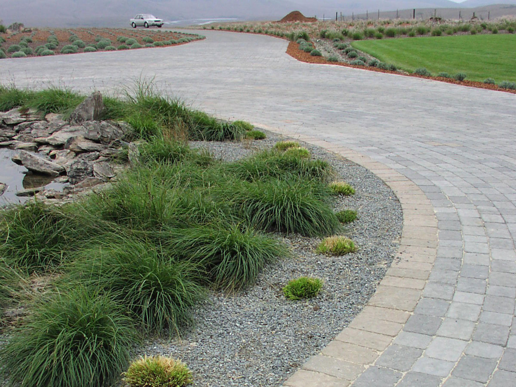 A flow-path with stone pavers by the Legacy Paver Group