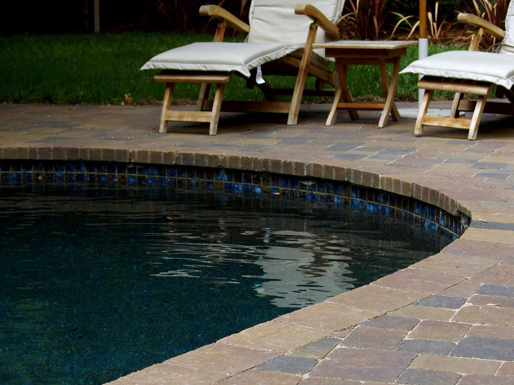 Swimming pool accented with stone pavers