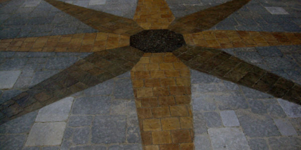 A stone compass inlay at the USF project
