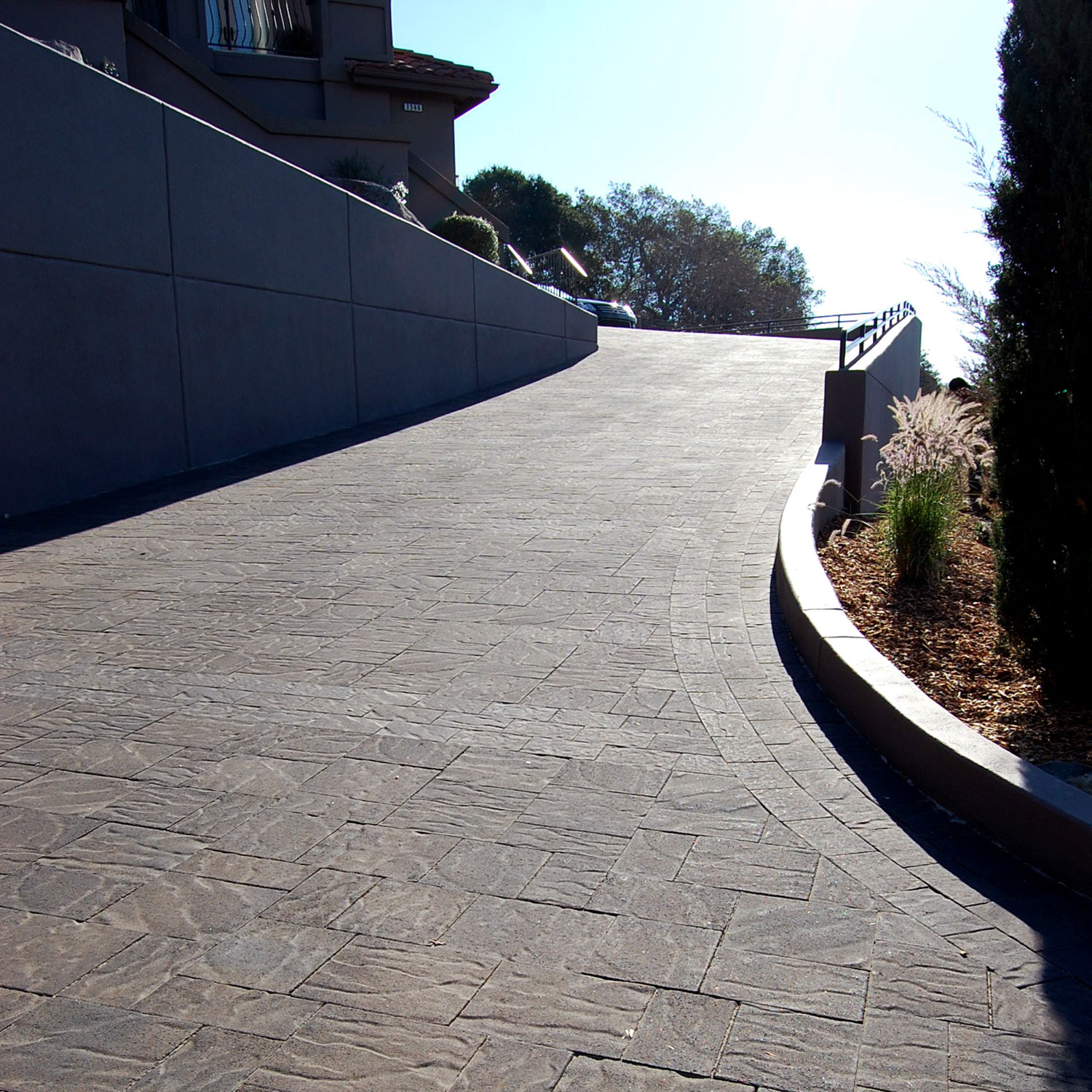 Steep driveway is made safer with stone pavers.